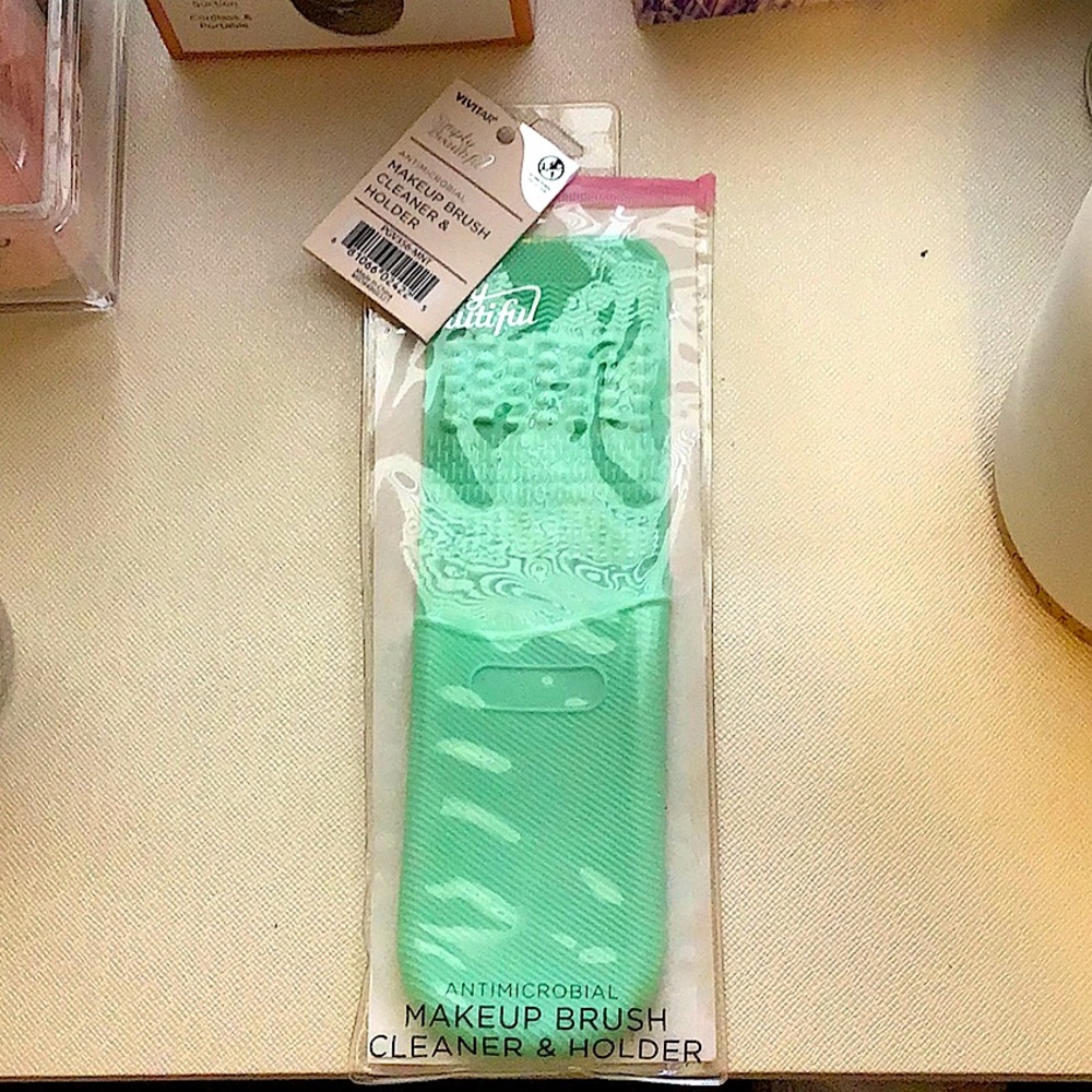 Anti-microbial makeup brush cleaner and holder